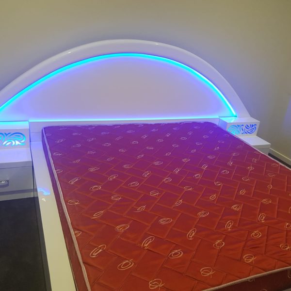 Elegant White Colored Double Bed with Blue Lighting
